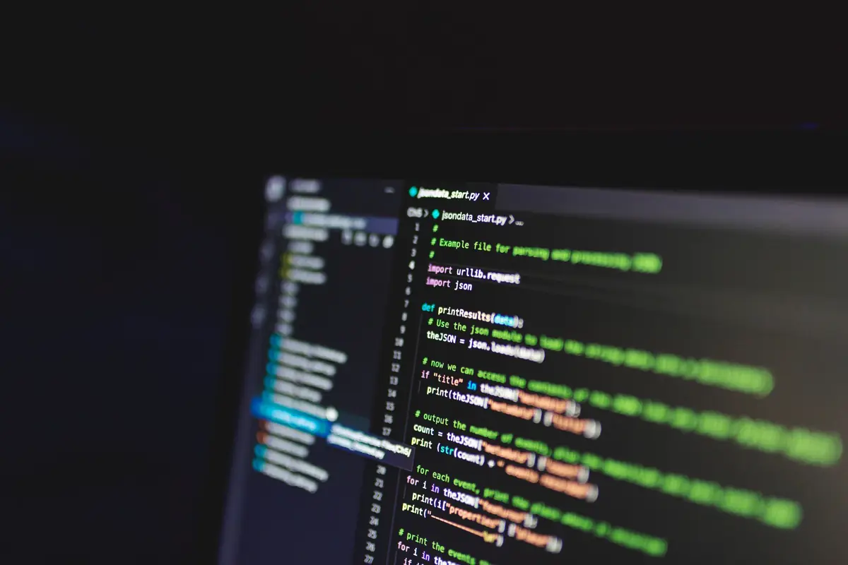 Source code on a screen in a dim room